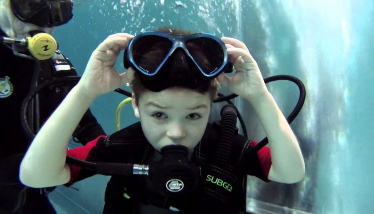 CHILD DIVER AND TEAM EXTREME DIVE